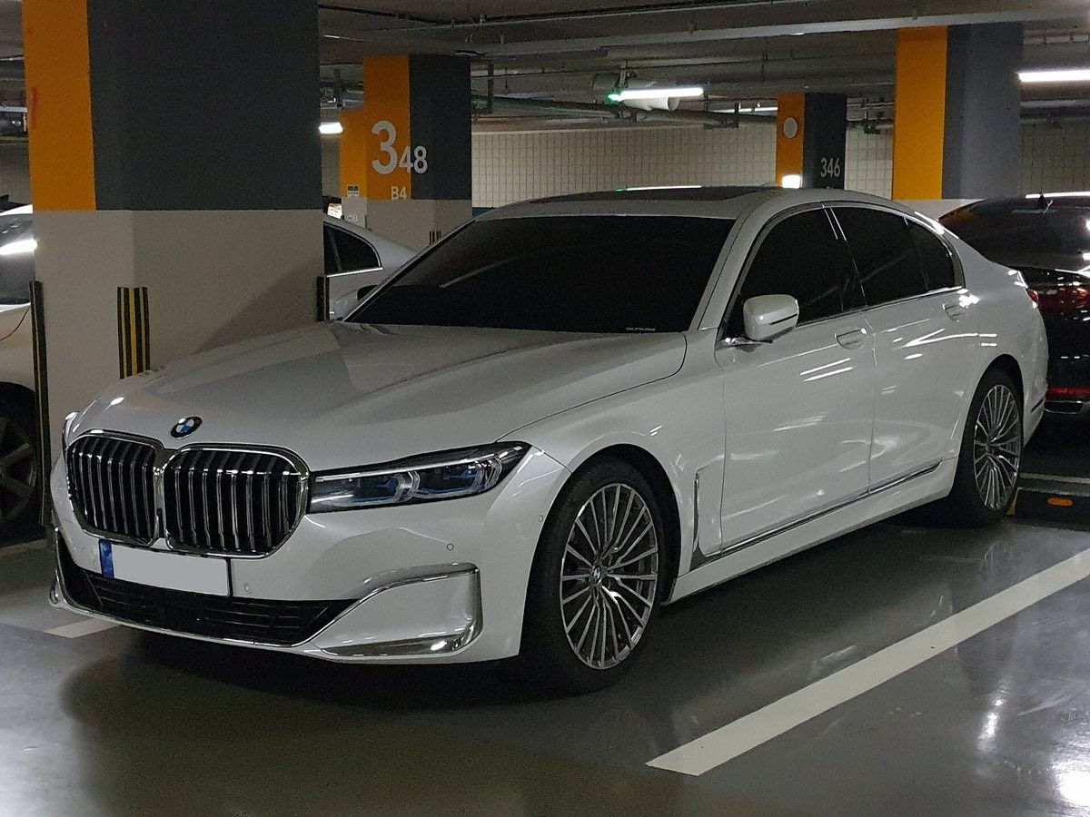 Front three-quarter view of a white 2020 BMW 740i