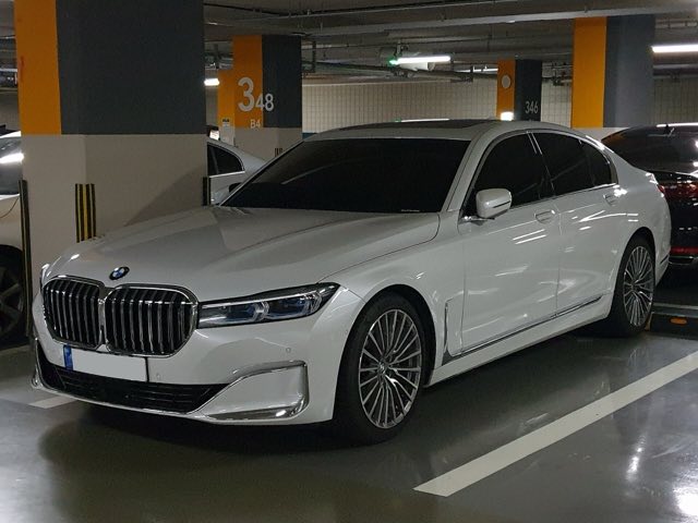 Front three-quarter view of a white 2020 BMW 740i